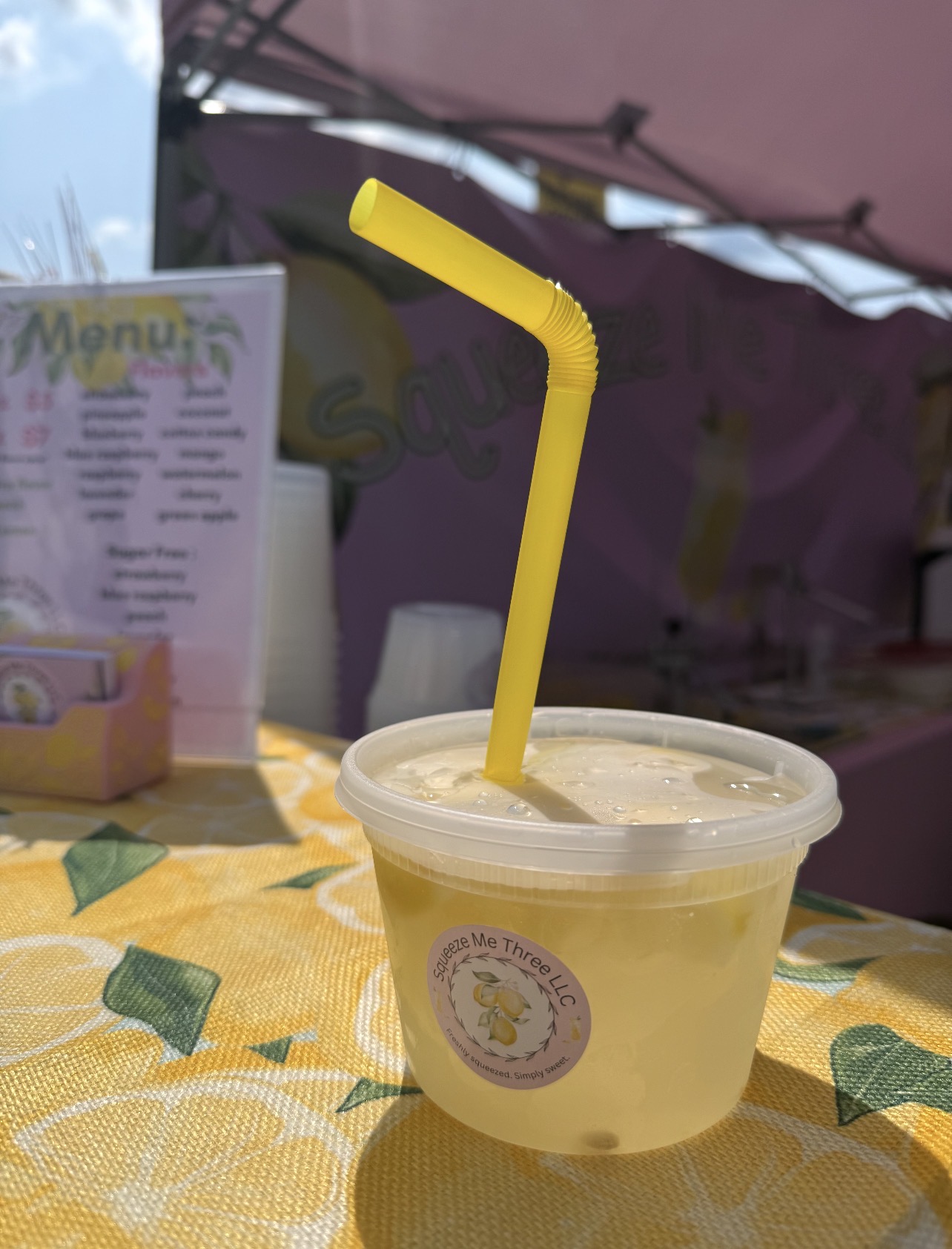 Freshly squeezed lemonade with the Squeeze Me Three logo